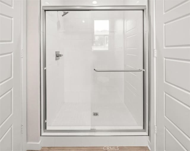 full bathroom featuring a shower stall