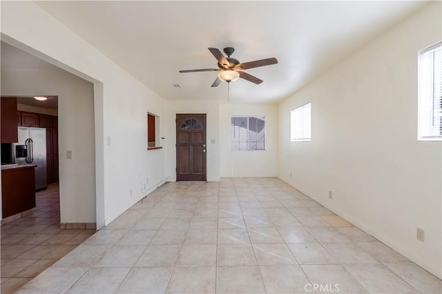 6125 Ridgeview Ave, Jurupa Valley, CA 91752 - empty room with ceiling fan and light tile patterned floors