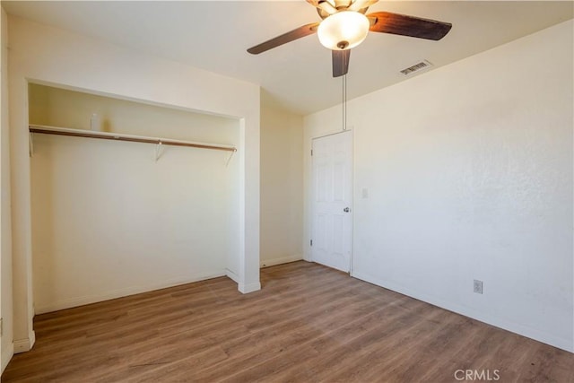 6125 Ridgeview Ave, Jurupa Valley, CA 91752 - unfurnished bedroom with wood finished floors, a closet, and ceiling fan