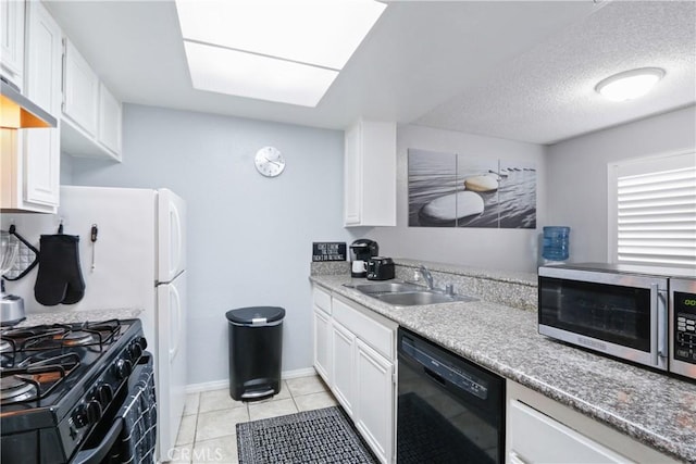 kitchen with white cabinets, a sink, black appliances, and light tile patterned floors