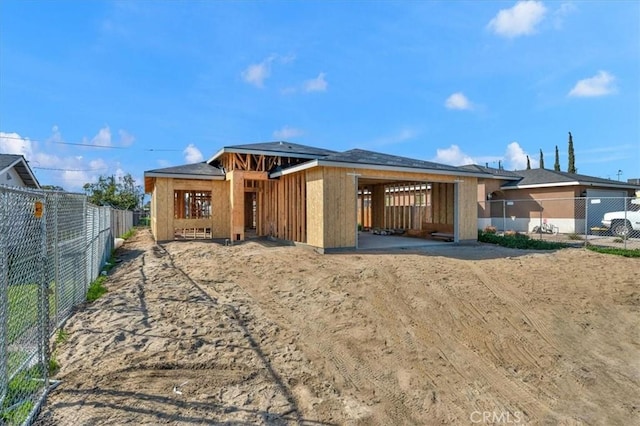 rear view of property with an outbuilding and an exterior structure