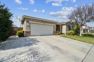 ranch-style house with a garage and concrete driveway