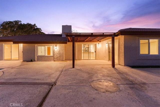 3190 E Vincentia Rd, Palm Springs, CA 92262 - rear view of property with a patio and stucco siding