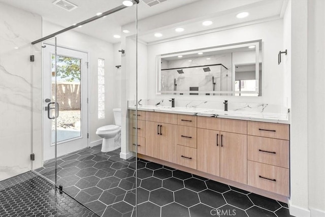 3190 E Vincentia Rd, Palm Springs, CA 92262 - bathroom featuring double vanity, a shower stall, toilet, recessed lighting, and tile patterned floors