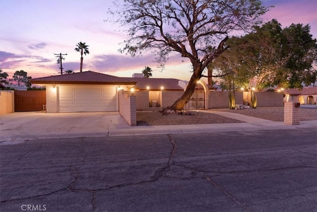 3190 E Vincentia Rd, Palm Springs, CA 92262 - ranch-style house featuring fence, concrete driveway, a garage, and stucco siding