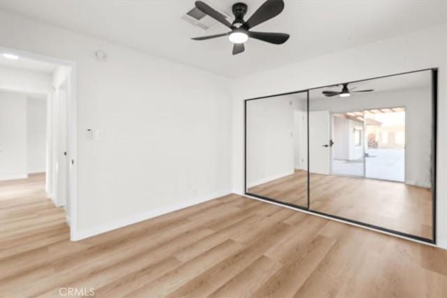 3190 E Vincentia Rd, Palm Springs, CA 92262 - unfurnished bedroom featuring wood finished floors, a closet, baseboards, and a ceiling fan