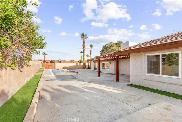 view of patio / terrace featuring a fenced in pool and a fenced backyard