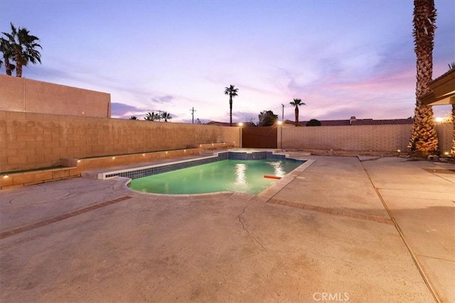 view of pool featuring a patio area, a fenced backyard, and a fenced in pool