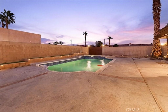 3190 E Vincentia Rd, Palm Springs, CA 92262 - pool at dusk with a fenced backyard and a patio