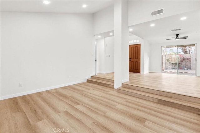 unfurnished living room featuring light wood-style flooring, visible vents, baseboards, and recessed lighting