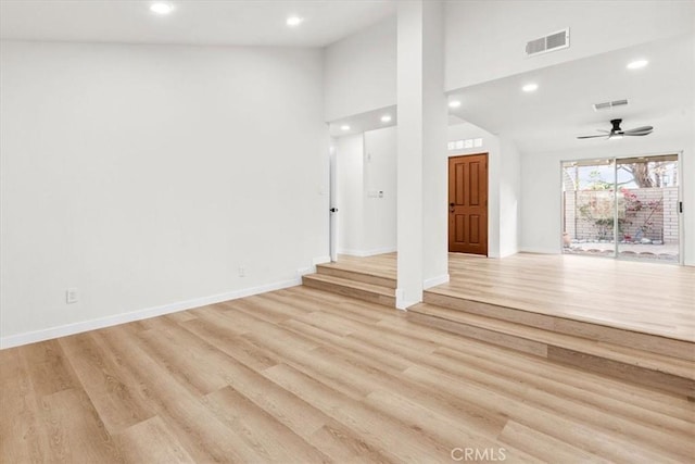 3190 E Vincentia Rd, Palm Springs, CA 92262 - unfurnished living room featuring recessed lighting, light wood finished floors, baseboards, ceiling fan, and a towering ceiling
