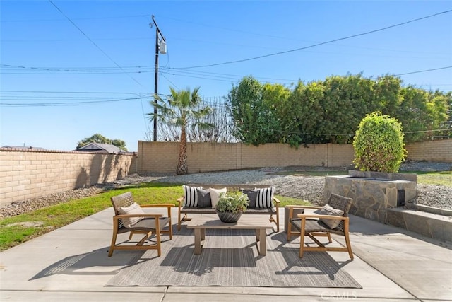 view of patio with a fenced backyard and an outdoor living space