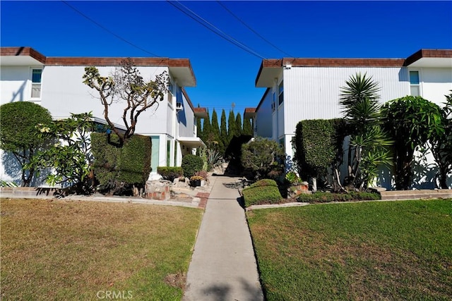 view of side of home featuring a yard