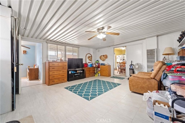 living area with a ceiling fan