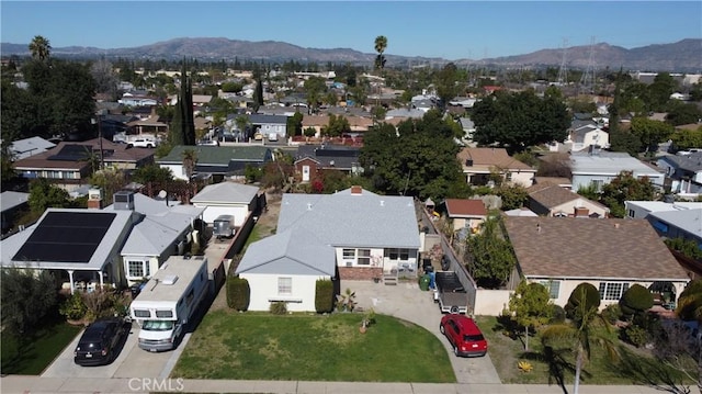 birds eye view of property featuring a residential view and a mountain view