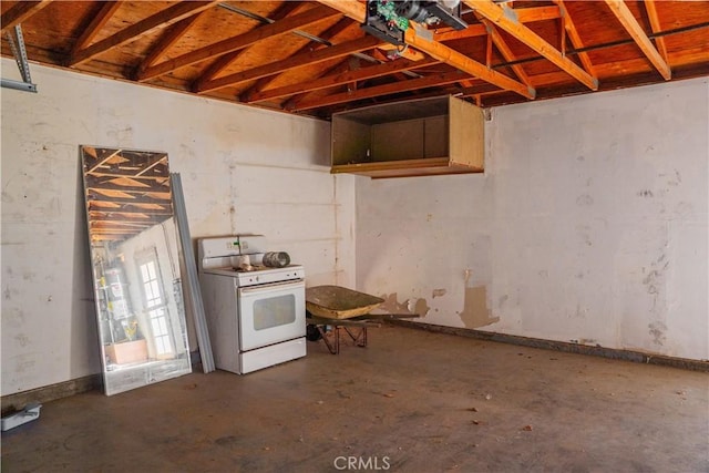 kitchen with concrete floors and white range with gas cooktop