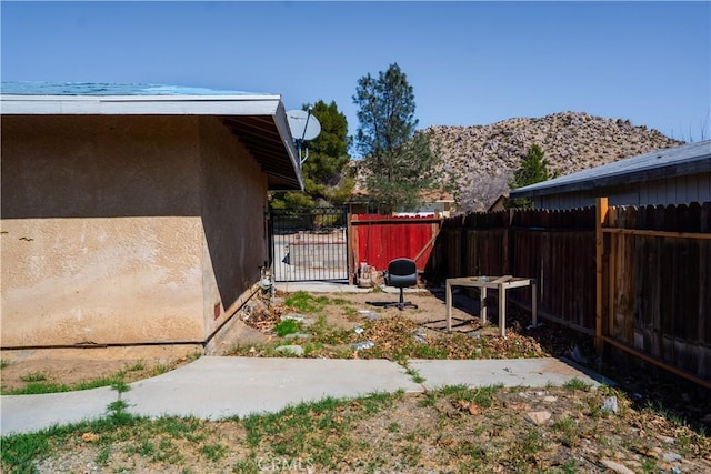 view of yard with a gate and fence