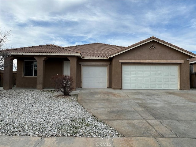 12912 Amador St, Victorville, CA 92392 - single story home with stucco siding, driveway, an attached garage, and a tiled roof