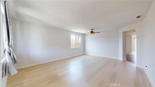 12912 Amador St, Victorville, CA 92392 - unfurnished room featuring light wood-style flooring, a ceiling fan, visible vents, and baseboards
