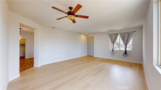 12912 Amador St, Victorville, CA 92392 - spare room with baseboards, visible vents, a ceiling fan, and light wood-style floors
