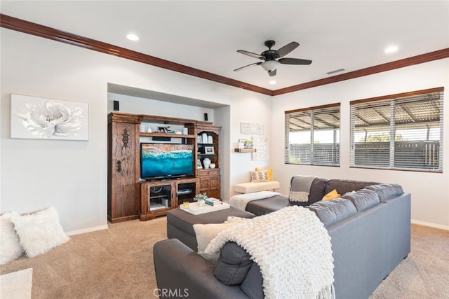 living area with light carpet, visible vents, a ceiling fan, and baseboards