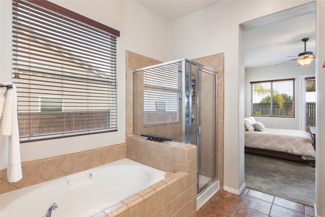 full bath featuring ensuite bathroom, ceiling fan, tile patterned flooring, a bath, and a stall shower