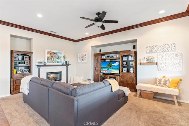 living area with baseboards, visible vents, a glass covered fireplace, carpet floors, and recessed lighting