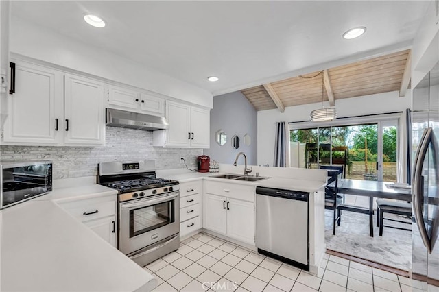 kitchen with a sink, stainless steel appliances, light countertops, under cabinet range hood, and backsplash