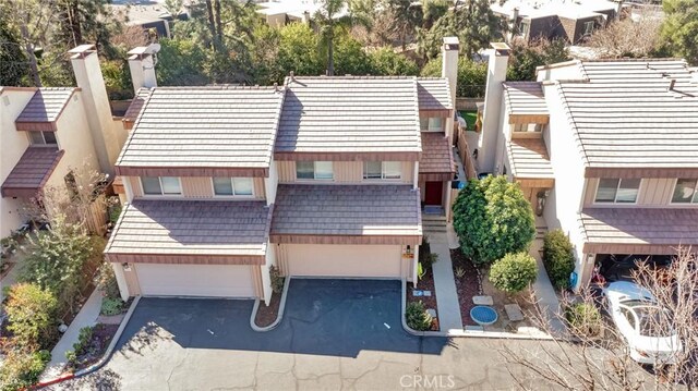 birds eye view of property with a residential view