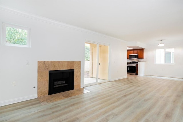 800 Sea Cliff Way Unit 801, Oceanside, CA 92056 - unfurnished living room featuring light wood finished floors, ornamental molding, and a fireplace