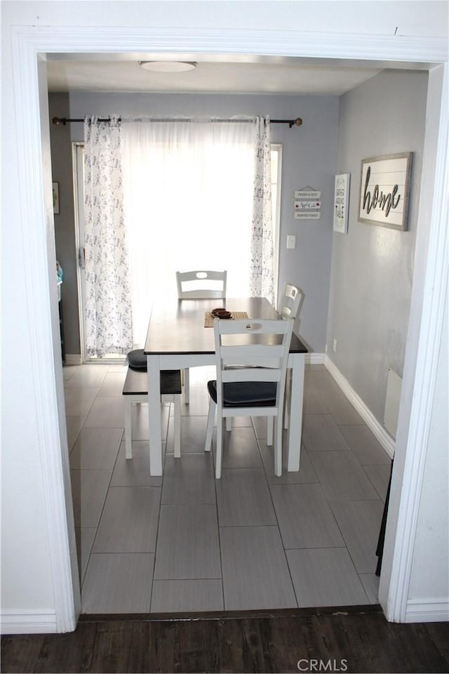 dining room with baseboards