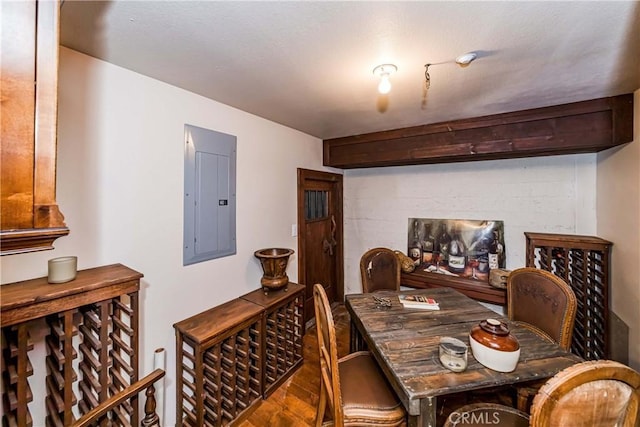 293 Fairway Dr, Lake Arrowhead, CA 92352 - dining space with electric panel, wood finished floors, and concrete block wall