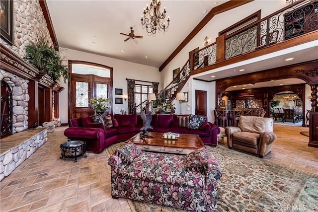 293 Fairway Dr, Lake Arrowhead, CA 92352 - living room featuring a ceiling fan, stone tile flooring, arched walkways, and high vaulted ceiling