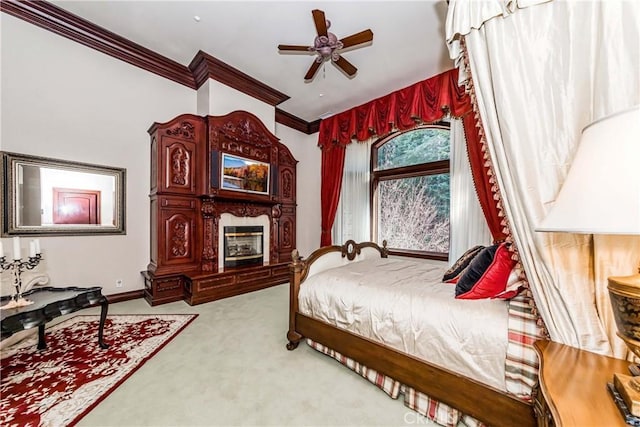 293 Fairway Dr, Lake Arrowhead, CA 92352 - bedroom featuring ornamental molding, baseboards, ceiling fan, light carpet, and a glass covered fireplace