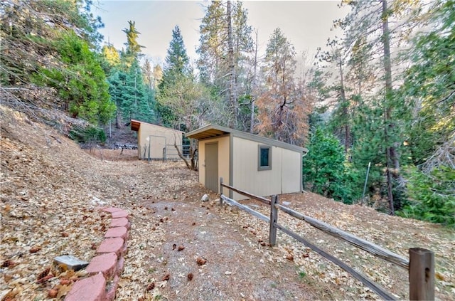 293 Fairway Dr, Lake Arrowhead, CA 92352 - view of yard with a storage unit and an outbuilding