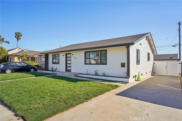 view of front of property with a front lawn and stucco siding