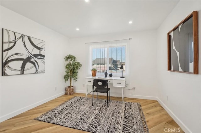 office featuring recessed lighting, wood finished floors, and baseboards