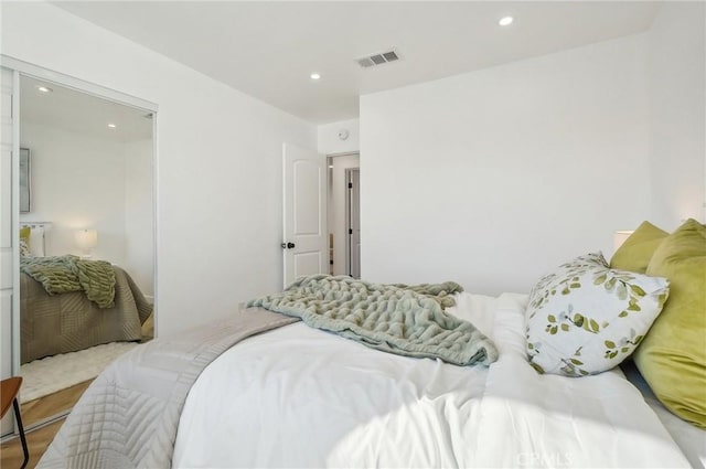 bedroom with visible vents and recessed lighting