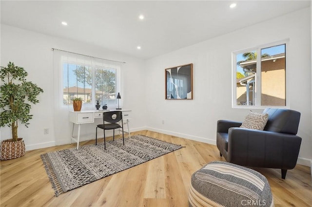 home office with light wood-style floors, baseboards, and recessed lighting