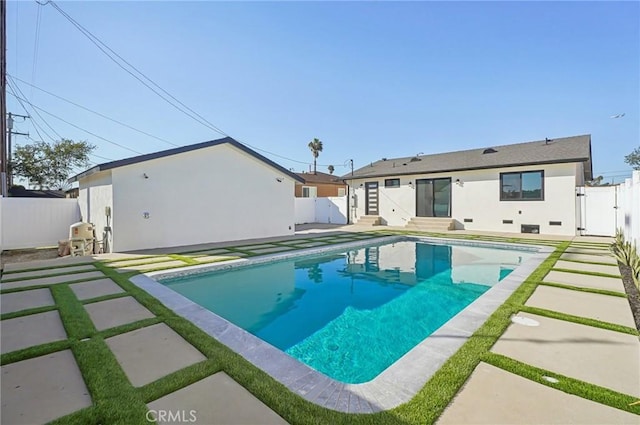 view of pool featuring entry steps, a fenced backyard, and a gate