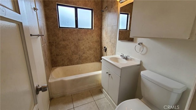 full bath with  shower combination, vanity, toilet, and tile patterned floors