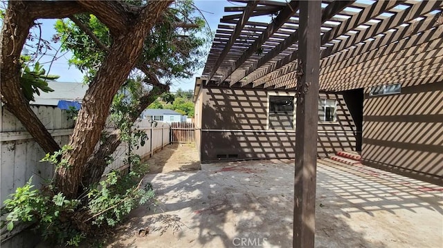 view of patio / terrace featuring a fenced backyard and a pergola