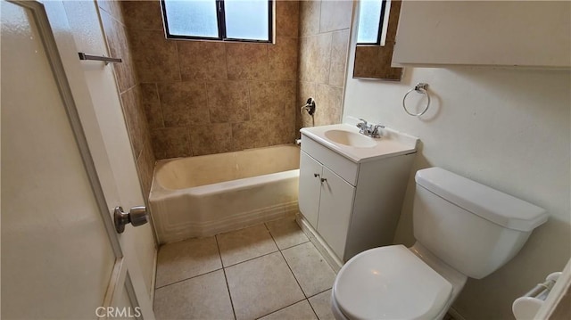 bathroom featuring shower / tub combination, vanity, toilet, and tile patterned floors