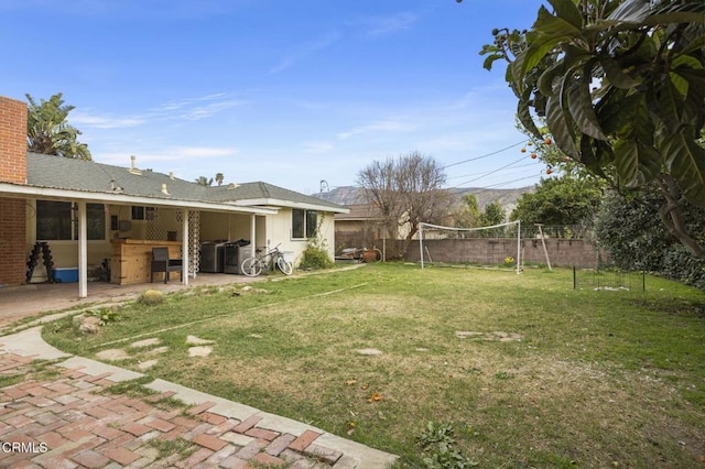 view of yard with a patio area and fence