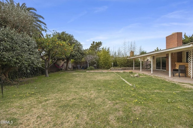 view of yard with a patio area and fence