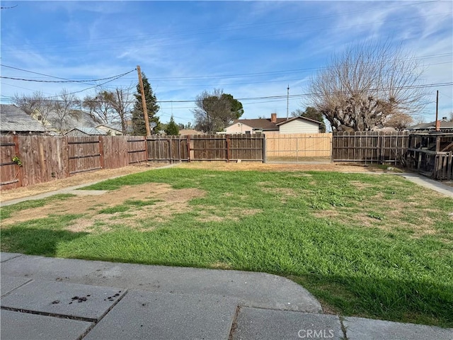 view of yard with a fenced backyard