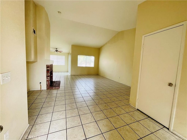 unfurnished living room with light tile patterned floors, ceiling fan, lofted ceiling, and visible vents