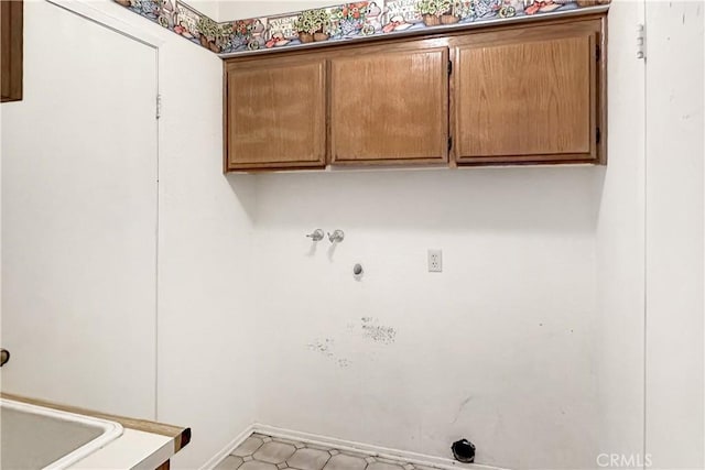 laundry room featuring cabinet space, washer hookup, and hookup for an electric dryer