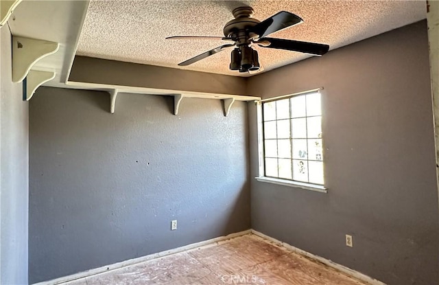 unfurnished room with a textured ceiling and ceiling fan