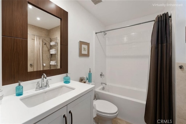 bathroom featuring visible vents, vanity, toilet, and shower / tub combo with curtain